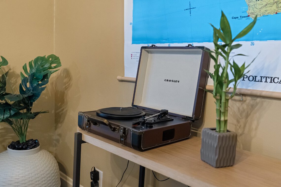 cairo st bungalow living room record player plant map